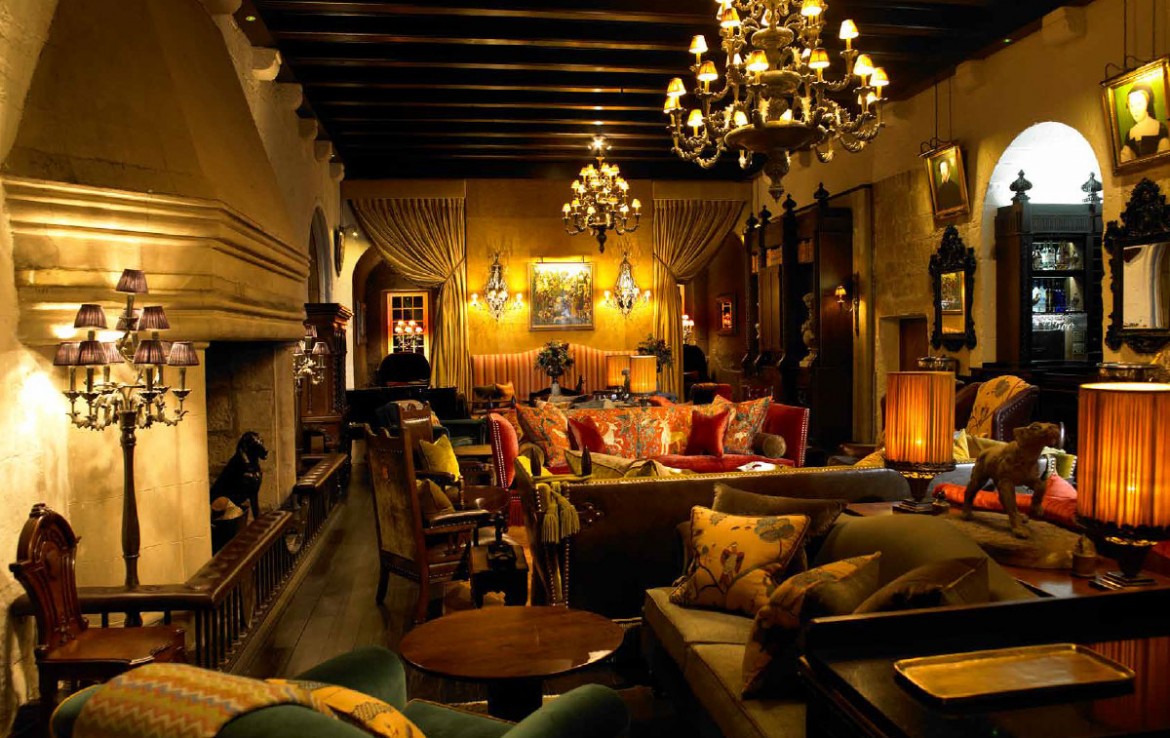 borthwick castle drawing room with couches and chandeliers
